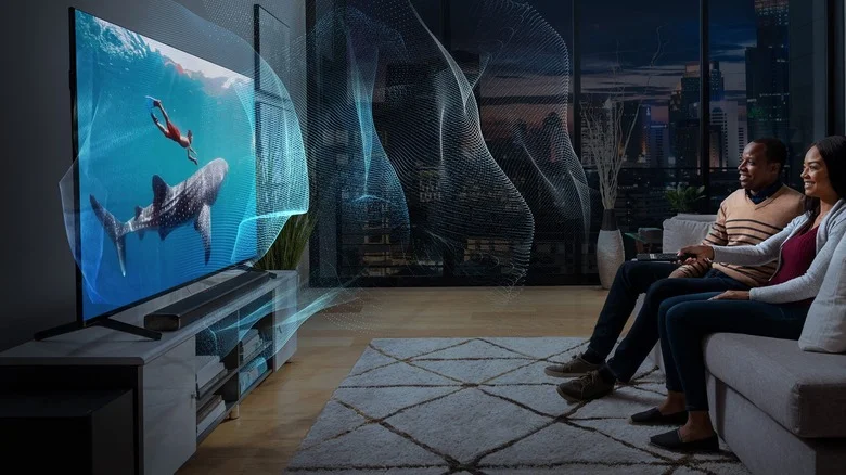 Couple watching TV on couch with immersive sound