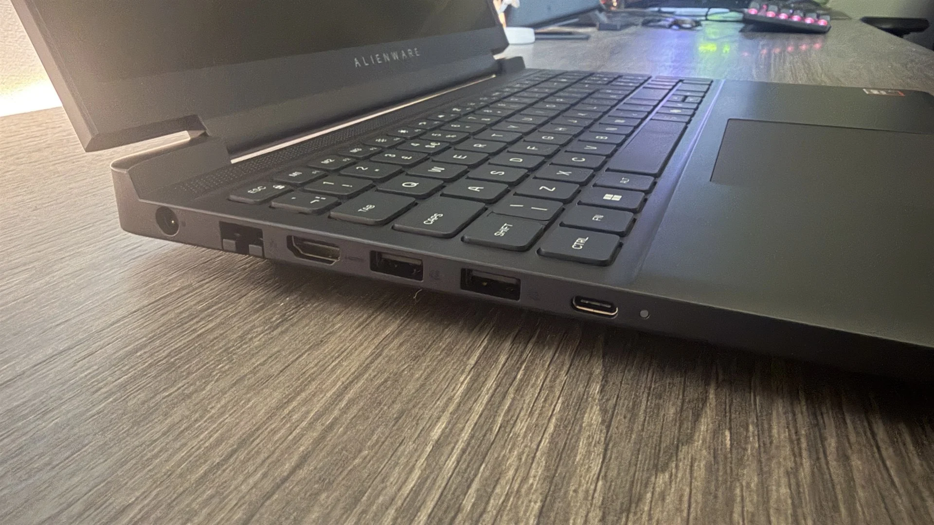 Alienware 15 (2026) gaming laptop on a wooden desk