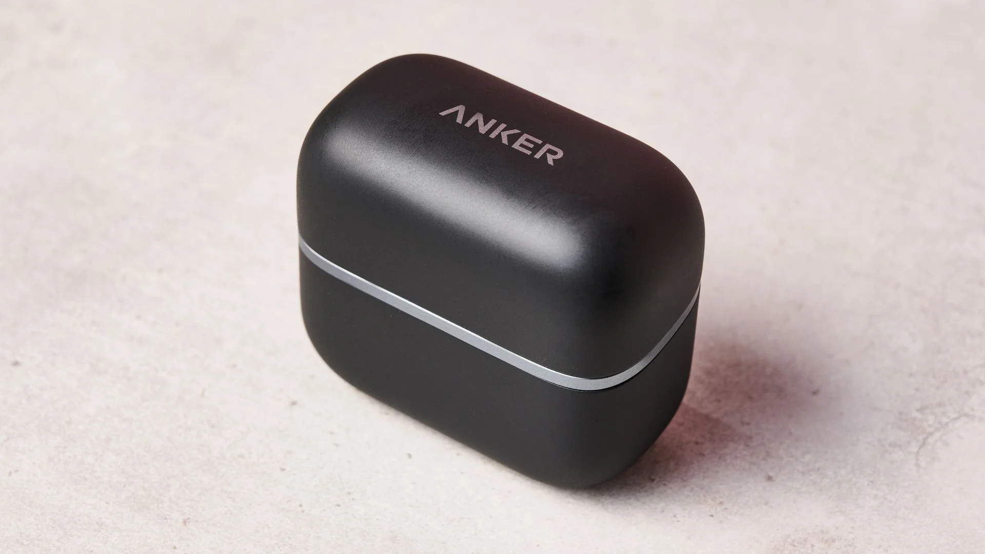 Anker logo on top of the Anker Soundcore AeroClip 2 charging case
