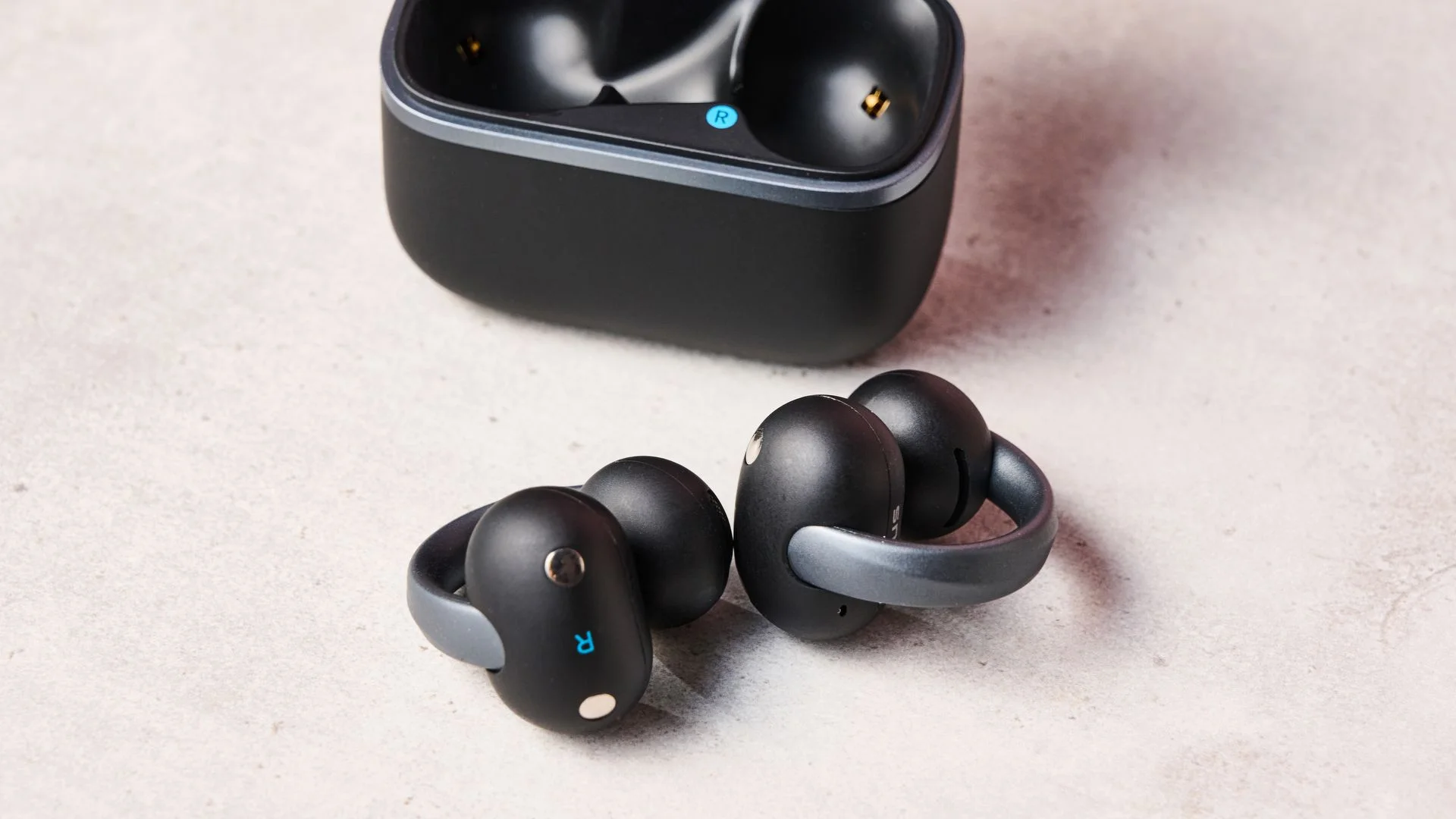 Anker Soundcore AeroClip 2 beside charging case