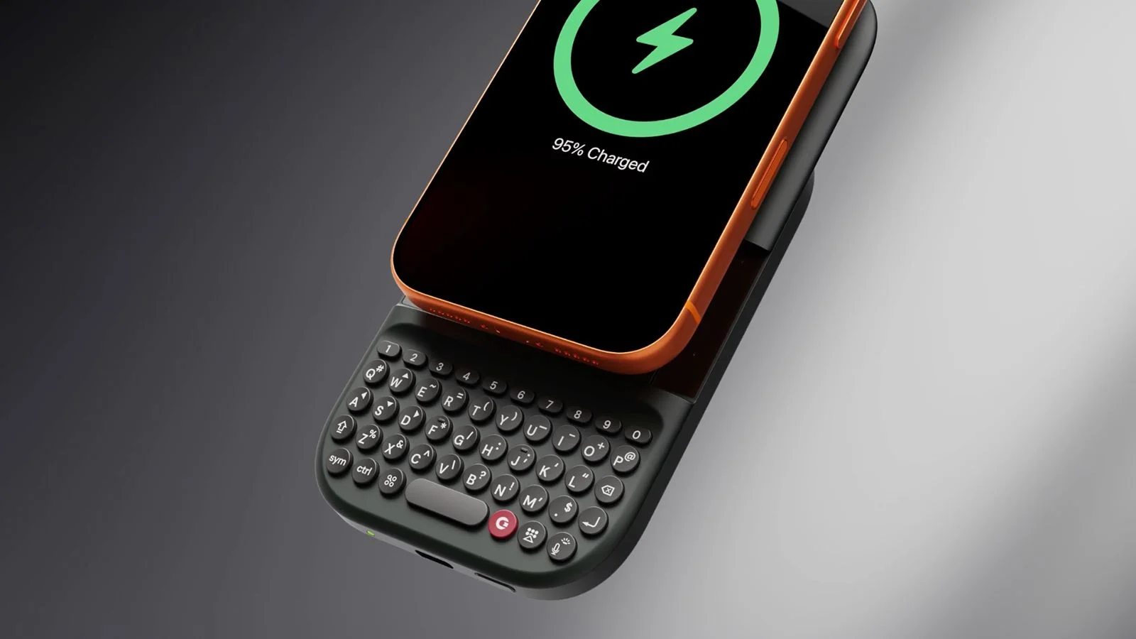 A Clicks Power Keyboard attached to a phone on a grey background.