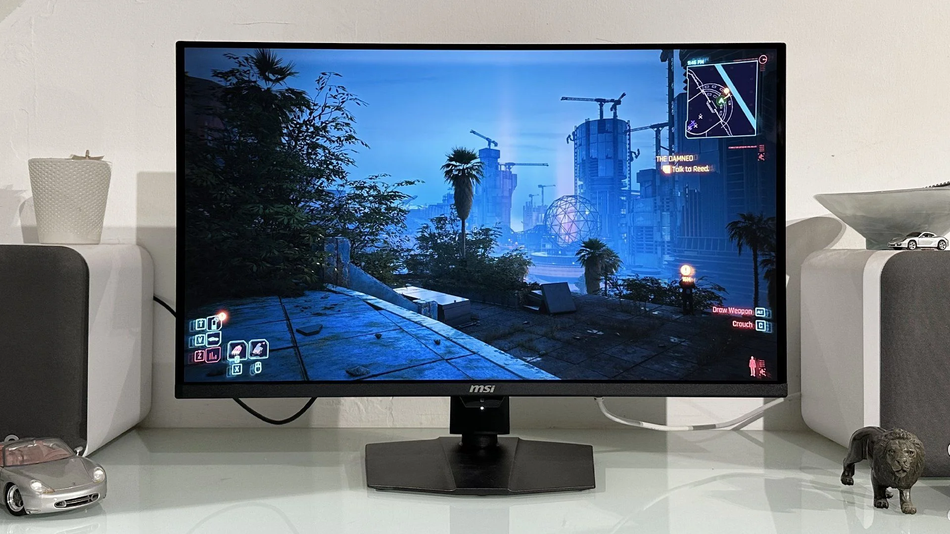 MSI MPG 322UR QD-OLED X24 monitor on a white desk