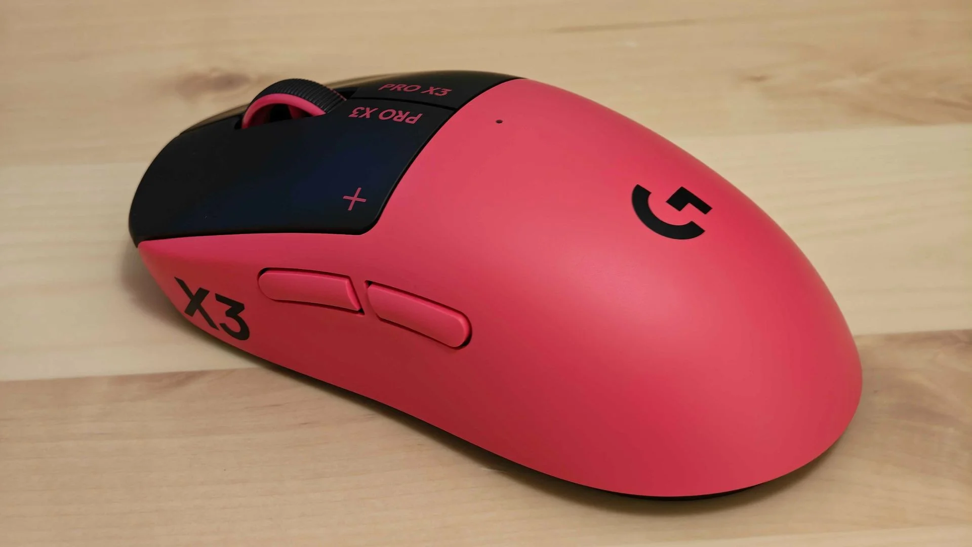 Logitech G Pro X3 Superstrike on a wooden table