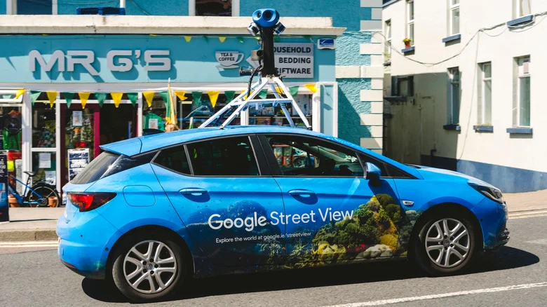 A blue Google Street View car captures street imagery.
